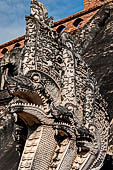 Chiang Mai - The Wat Chedi Luang. The massive chedi heavily damaged by an earthquake. The four staircases are protected by recentely restored guardian naga. 